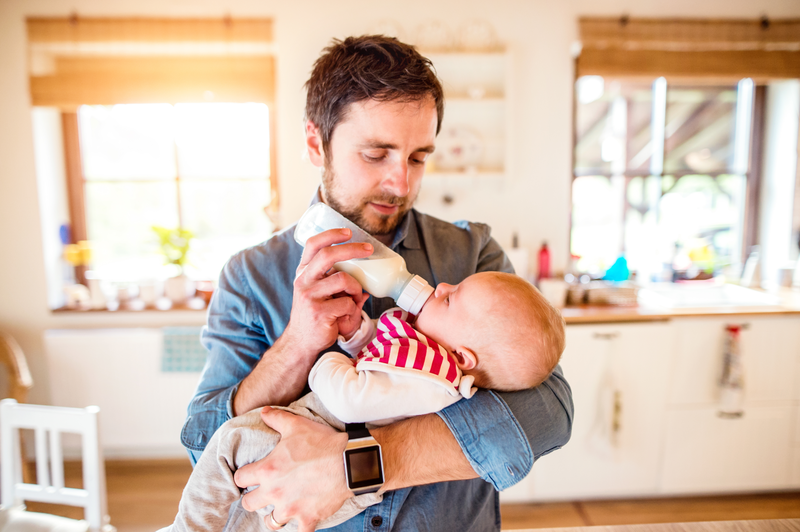 Loving Father Caring For His Adorable Newborn Baby Cradling Him Gently SBI 305199854