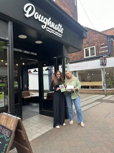 Megan from Nexus Fostering with Heidi from Doughnotts outside The Beeston branch